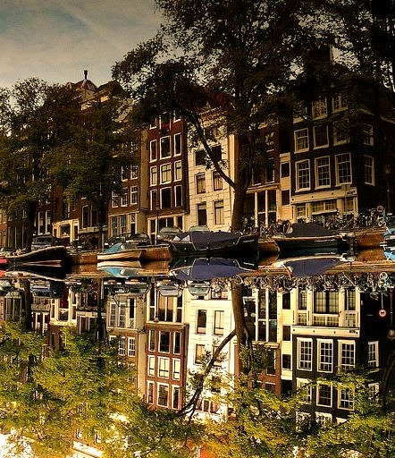 Buildings reflected in the Singel canal, Amsterdam, Netherlands