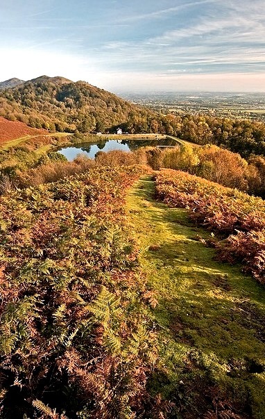 Grassy path leading down the hills to the reservoir, Malvern Hills / England